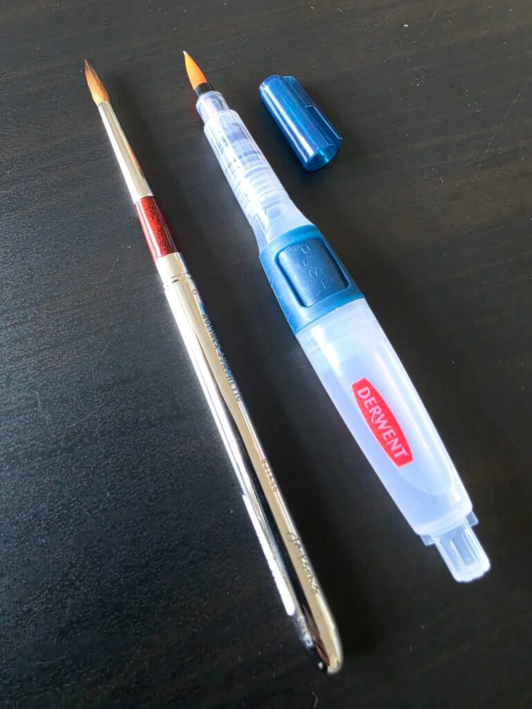 The large Derwent push-button waterbrush and Jackson's Travel Brush that were used in the painting.